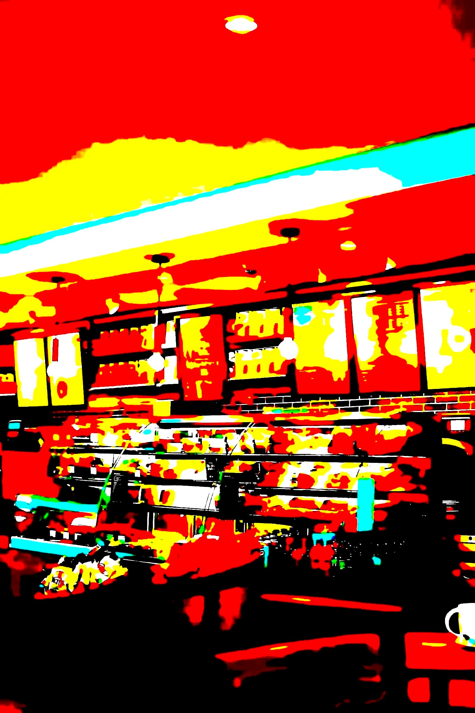 Coffee shop interior with a barista preparing drinks