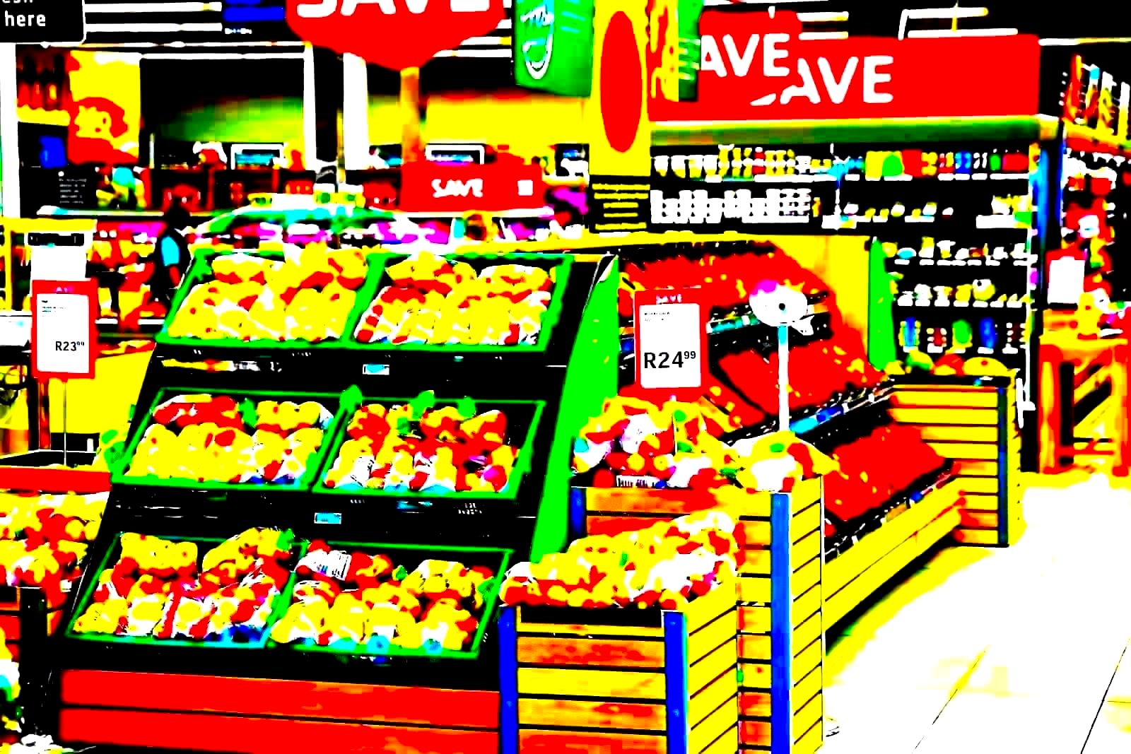 Shoppers pushing carts through a warehouse-club store aisle