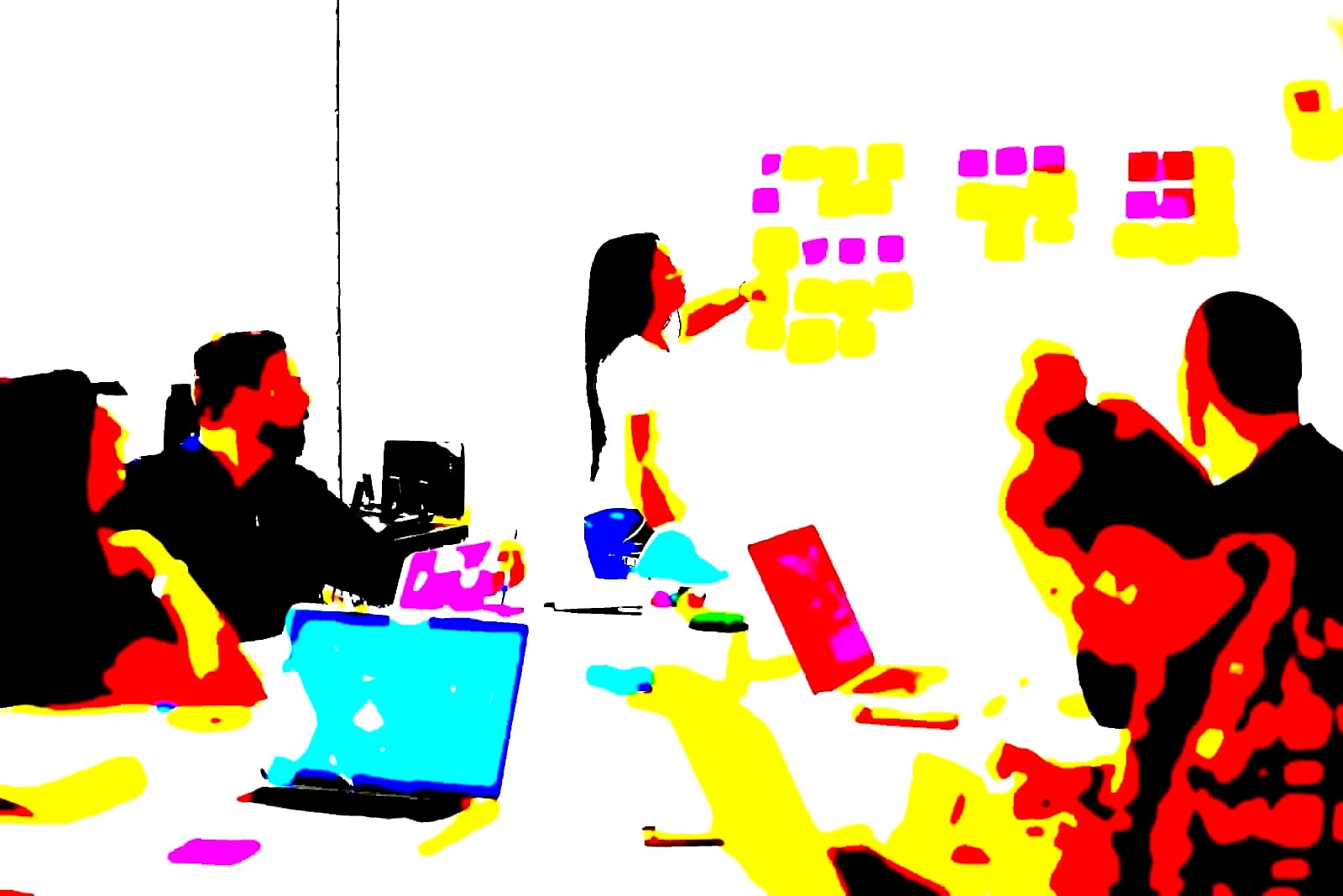 Employees seated in a corporate training room with a presenter at the front
