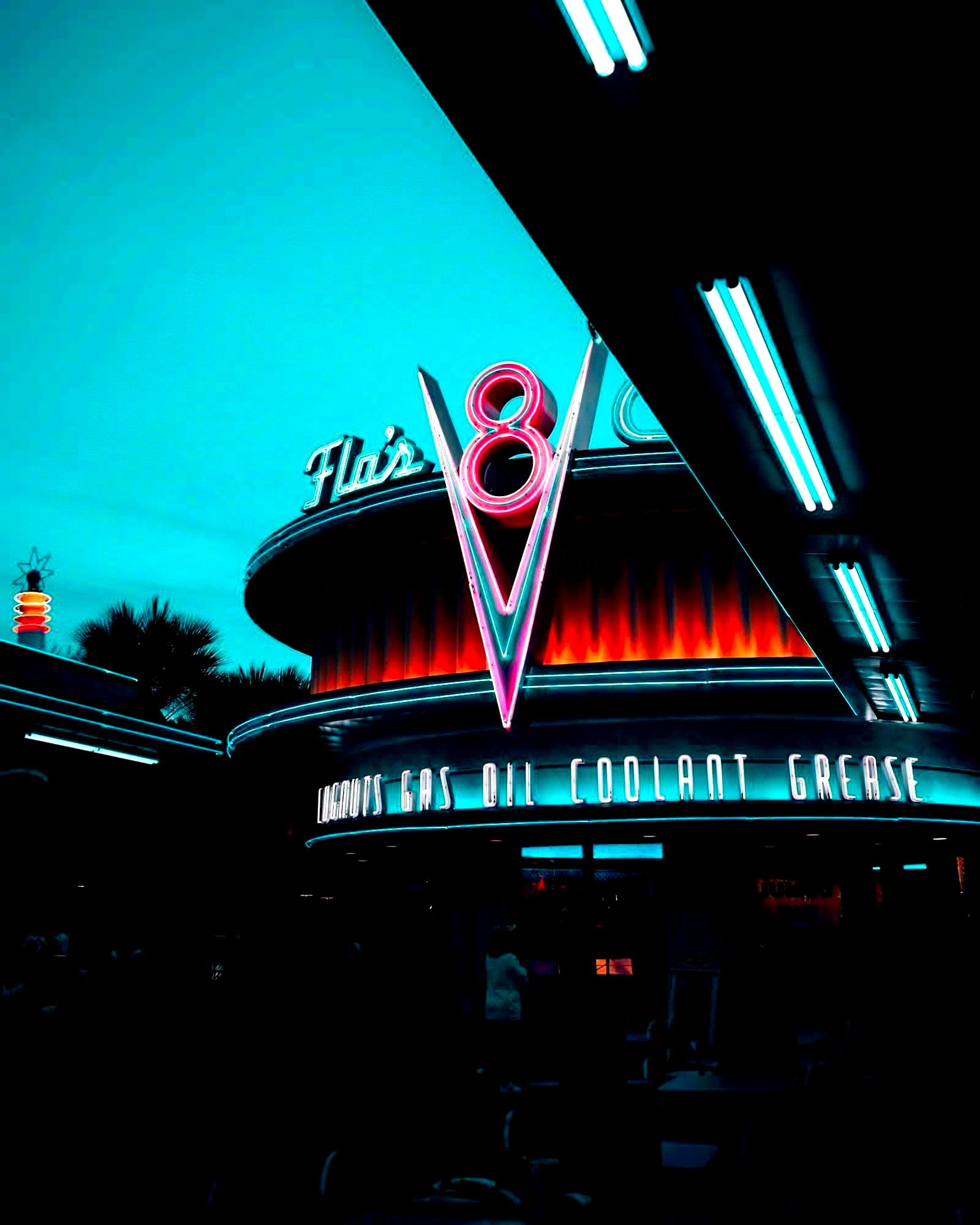 Illuminated Flo's V8 Café attraction at Disney California Adventure Park at night