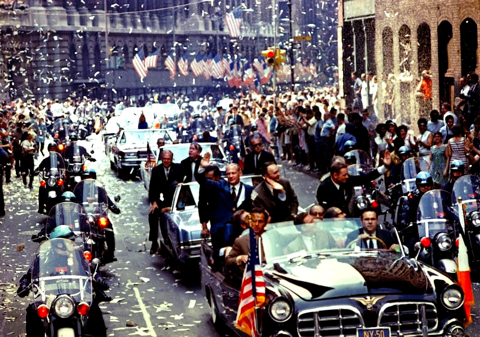 Ticker-tape confetti falling over a New York City parade in the Canyon of Heroes
