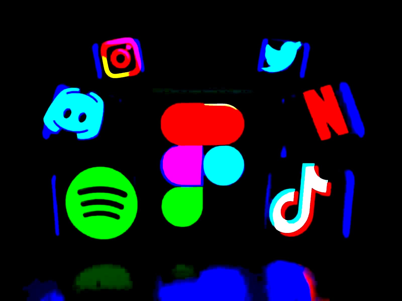 Person holding smartphone with social media apps including Facebook and Instagram