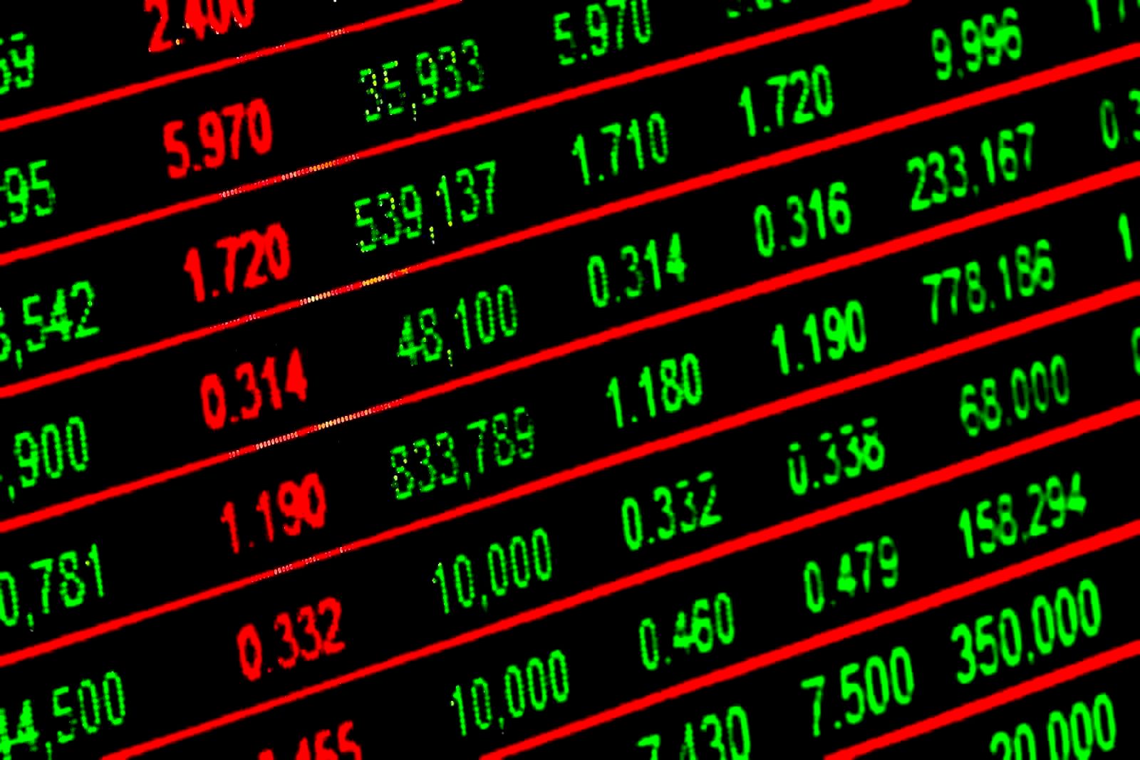 Trading floor with monitors displaying market data, representing institutional finance operations
