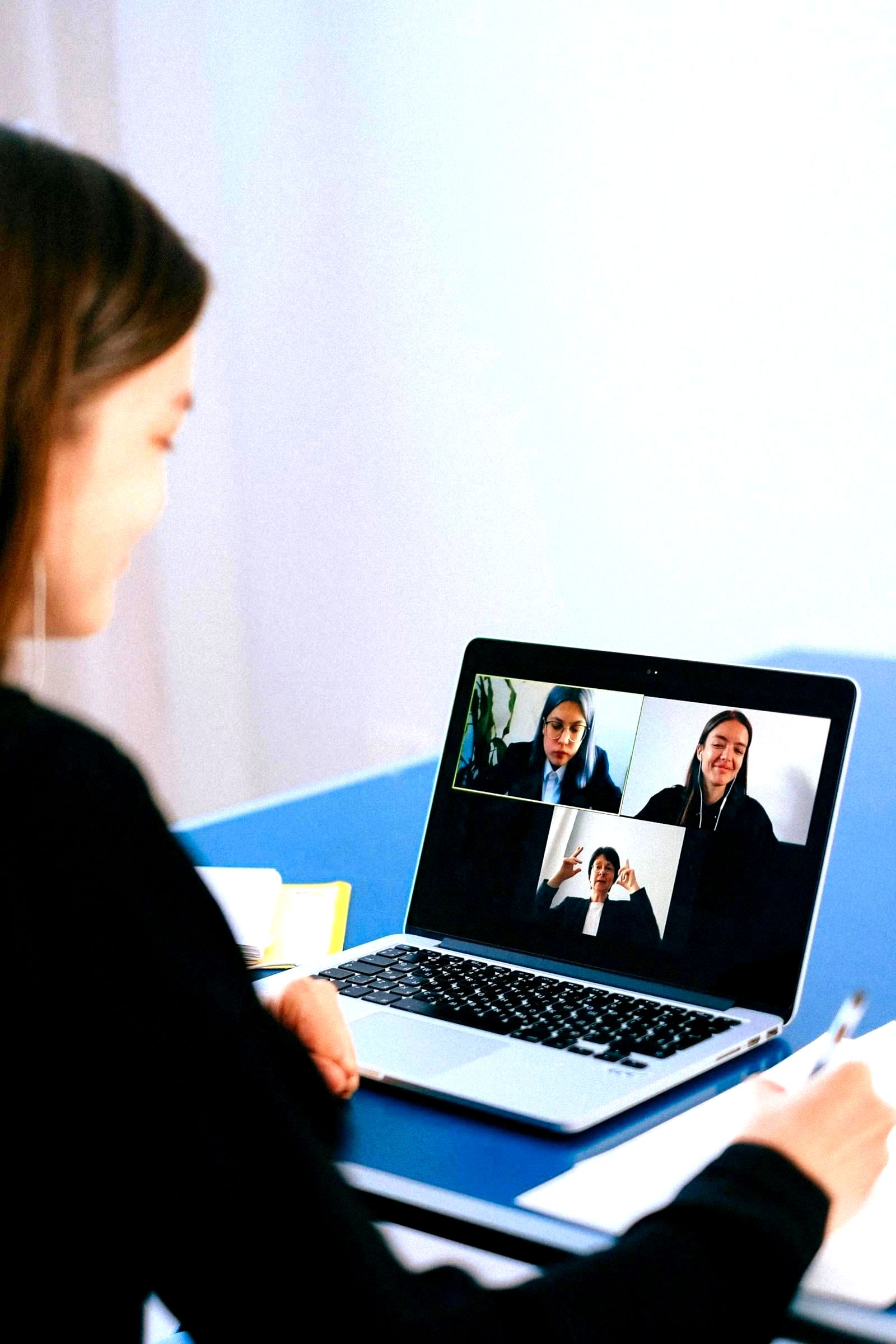 Person using a laptop computer with a financial application open on screen
