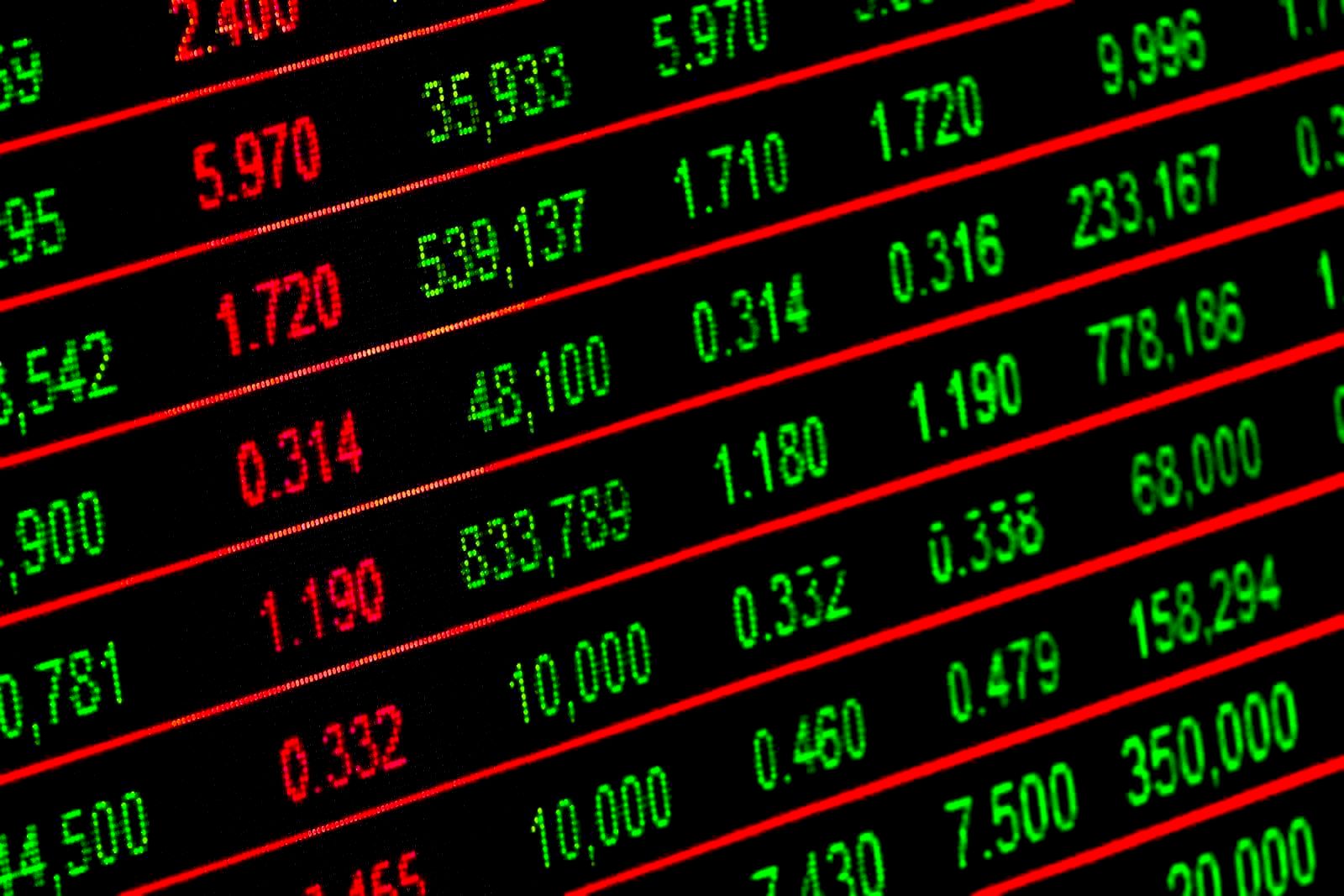Financial charts and fund performance documents on a desk
