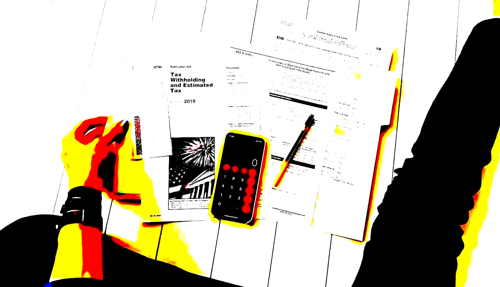 Calculator and financial documents on a desk used for pay equity calculations
