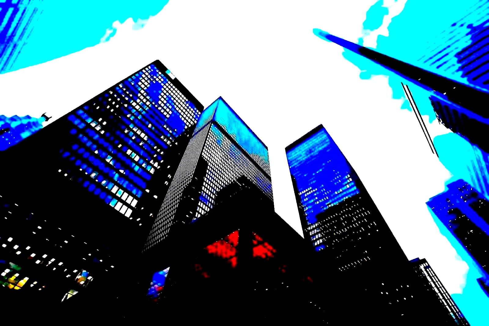 The exterior of a modern glass-walled financial services tower in midtown Manhattan