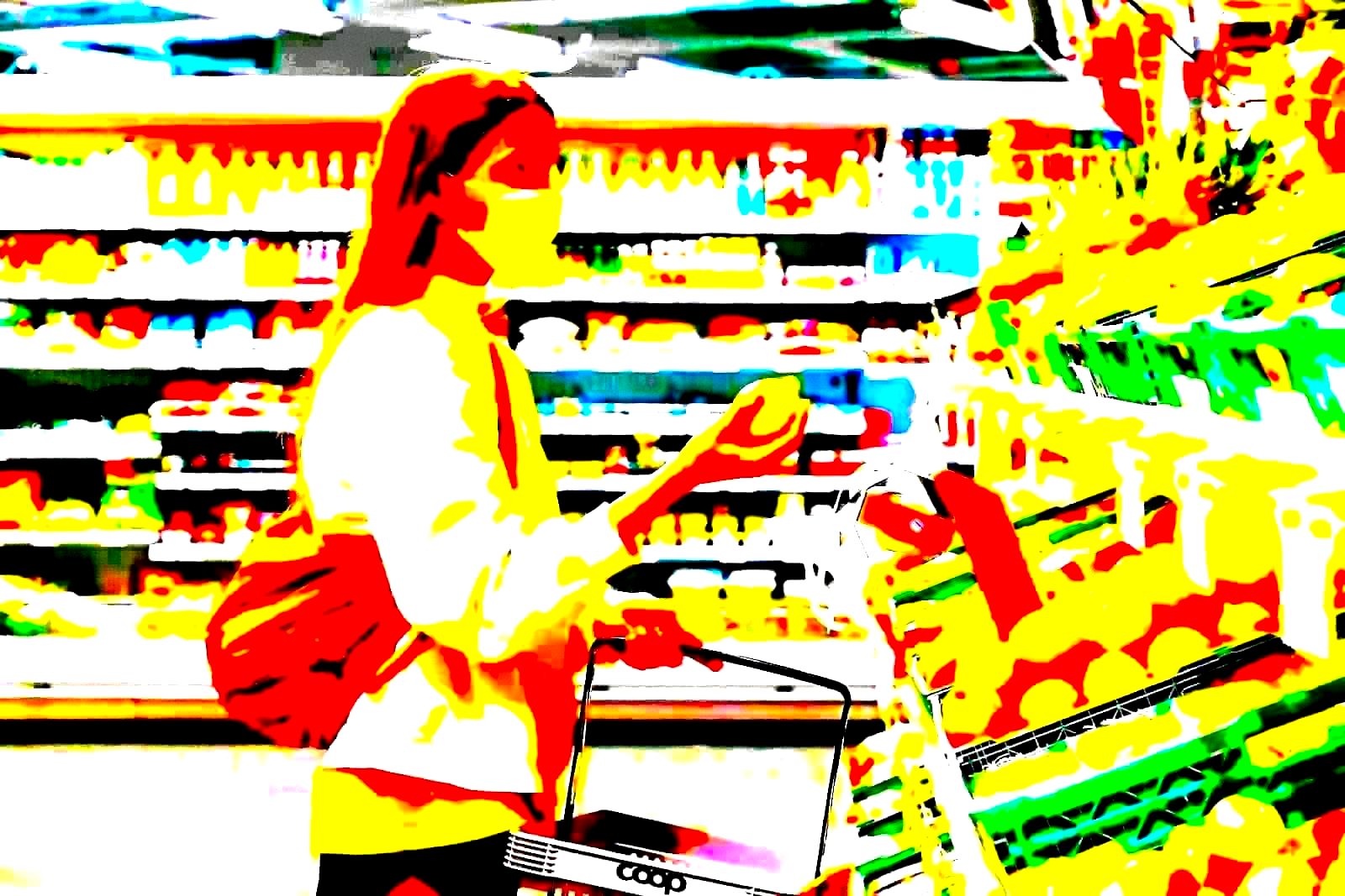 Retail cashier scanning items at a checkout counter