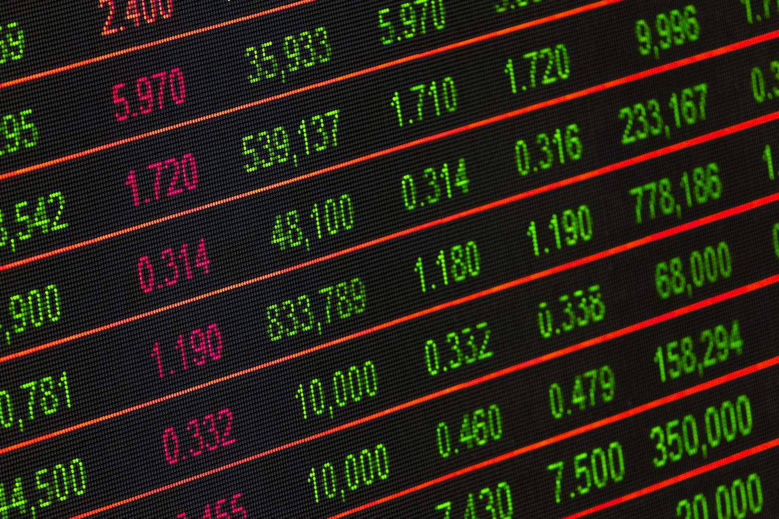 LED market data board showing rows of share prices in green and red